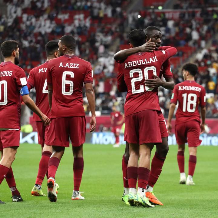 AL KHOR, QATAR - DECEMBER 06: Almoez Ali of Qatar celebrates with teammates after scoring their team's first goal during the FIFA Arab Cup Qatar 2021 Group A match between Qatar and Iraq at Al Bayt Stadium on December 06, 2021 in Al Khor, Qatar. (Photo by Maddie Meyer - FIFA/FIFA via Getty Images)